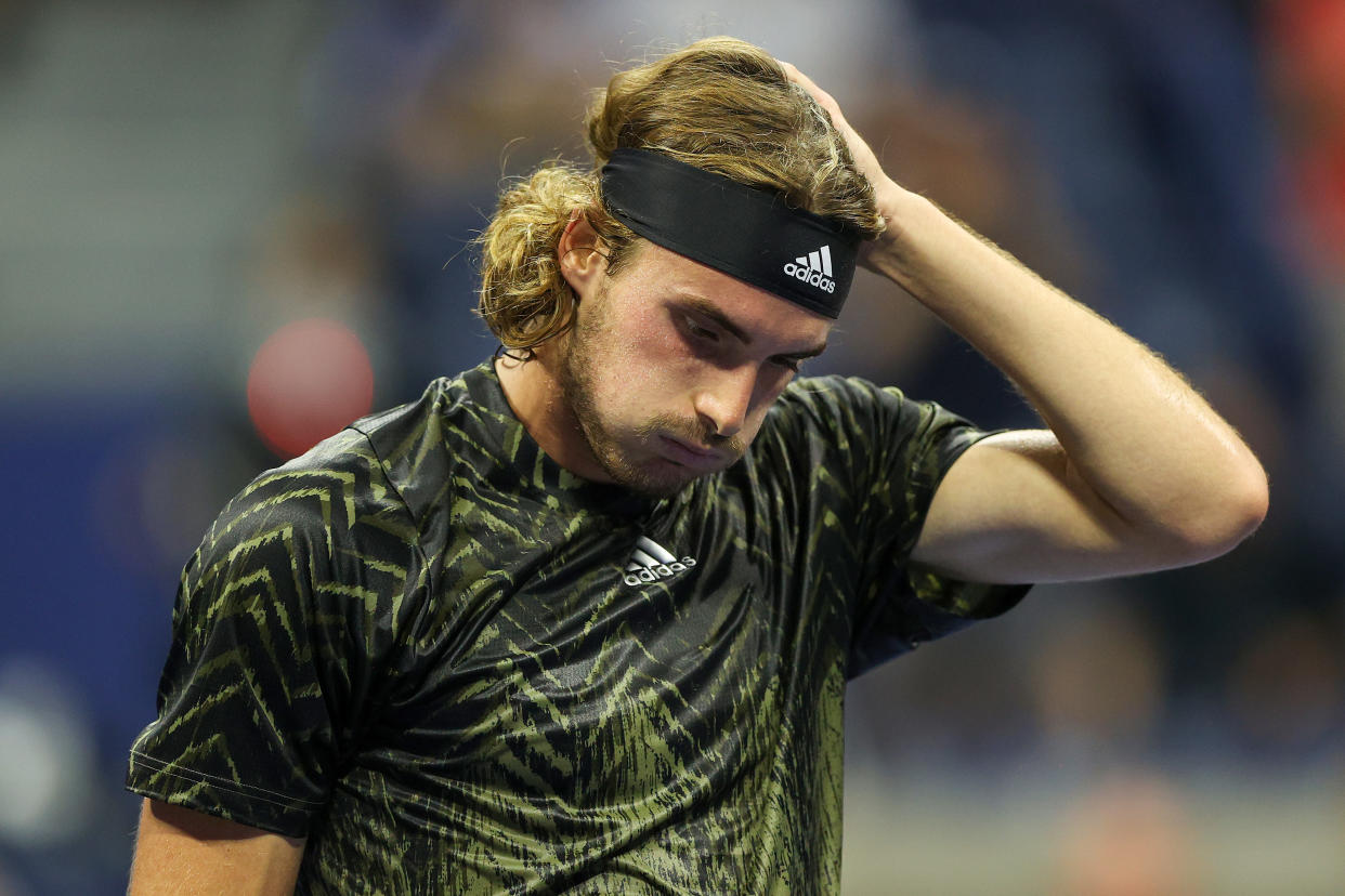 NEW YORK, NEW YORK - AUGUST 30:  Stefanos Tsitsipas of Greece reacts against Andy Murray of United Kingdom during their men's singles first round match on Day One of the 2021 US Open at the Billie Jean King National Tennis Center on August 30, 2021 in the Flushing neighborhood of the Queens borough of New York City. (Photo by Elsa/Getty Images)