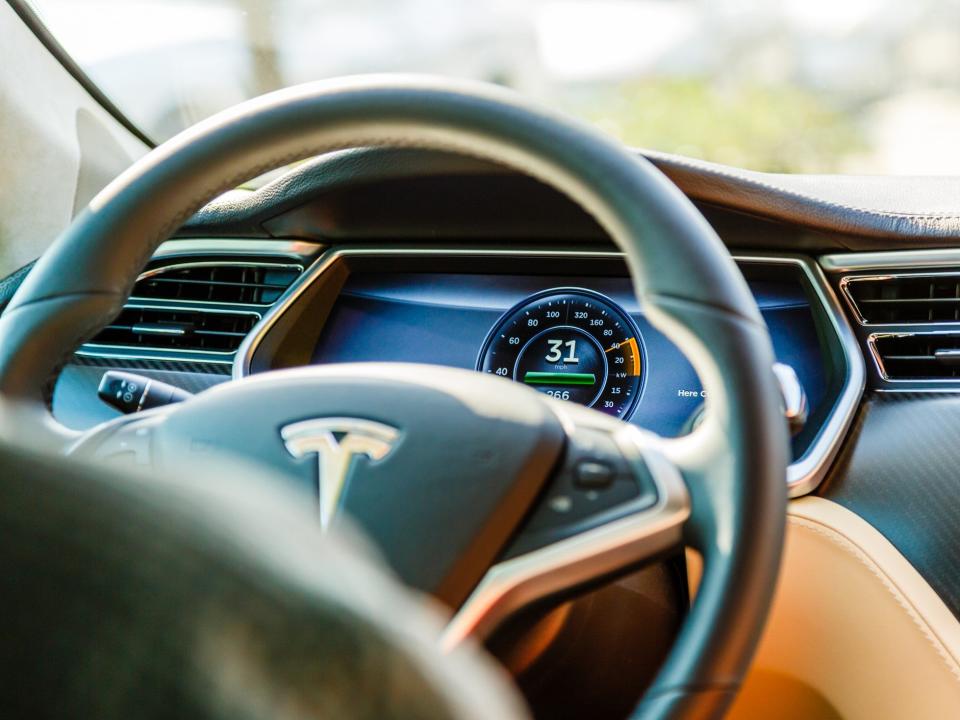 A camera on the rear-view mirror of the Tesla Model 3 can tell if a driver is looking at their phone in the moments before an accident (Getty Images)