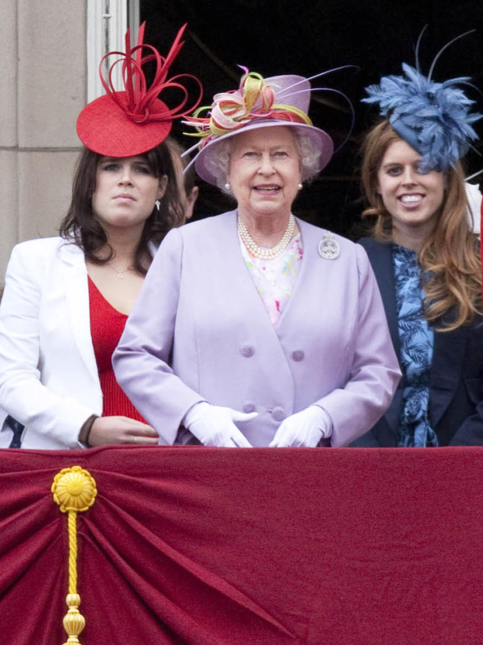 Back in 2010, Beatrice and Eugenie wore flamboyant fascinators for the regal celebrations. Her Majesty on the other hand, wore a lavender-hued co-ord. (Rex pictures)