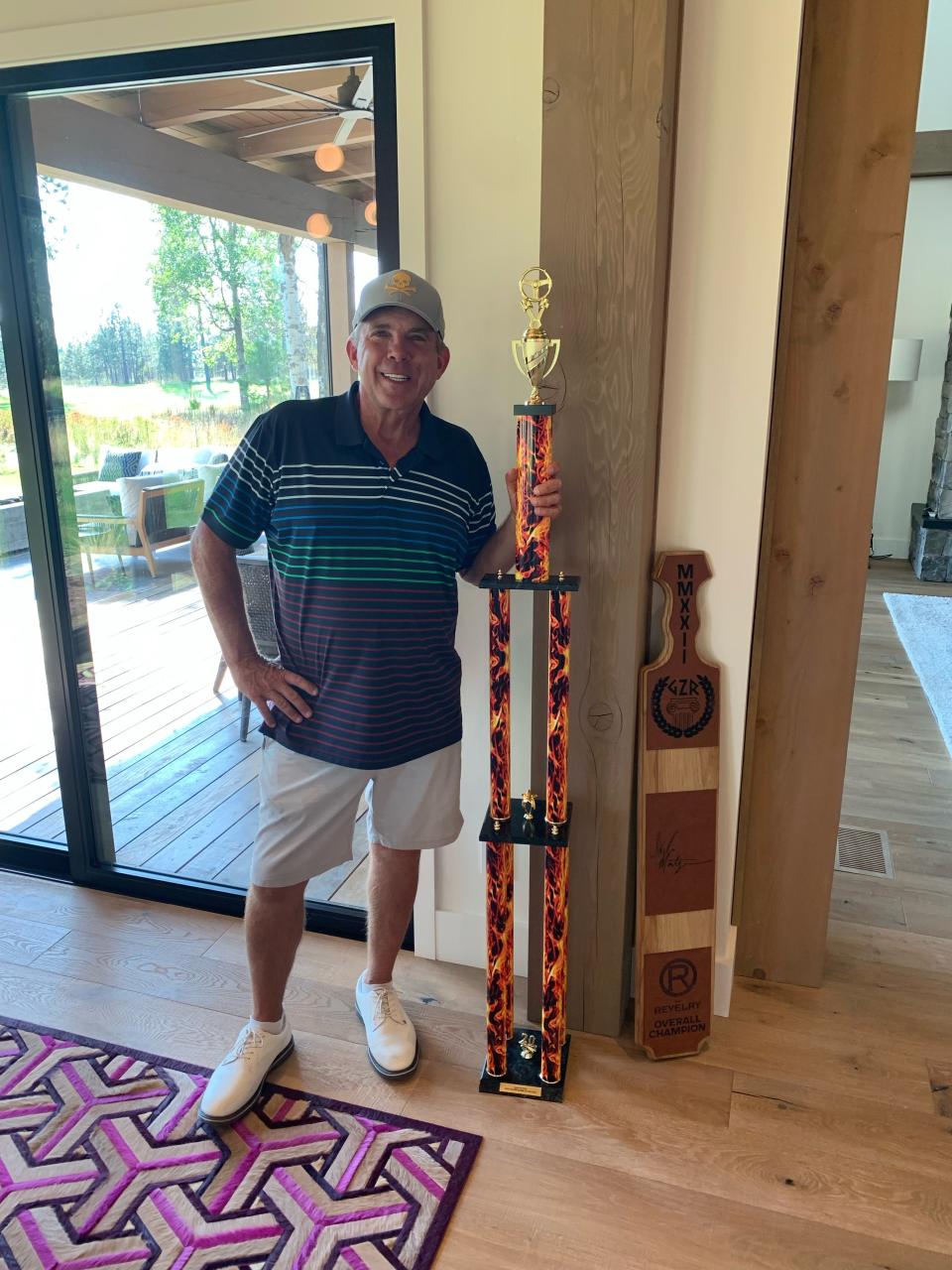 Sean Payton is enjoying his year off from football. Here he is with the trophy presented by Wayne Gretzky that is inscribed "Rookie of the Year."