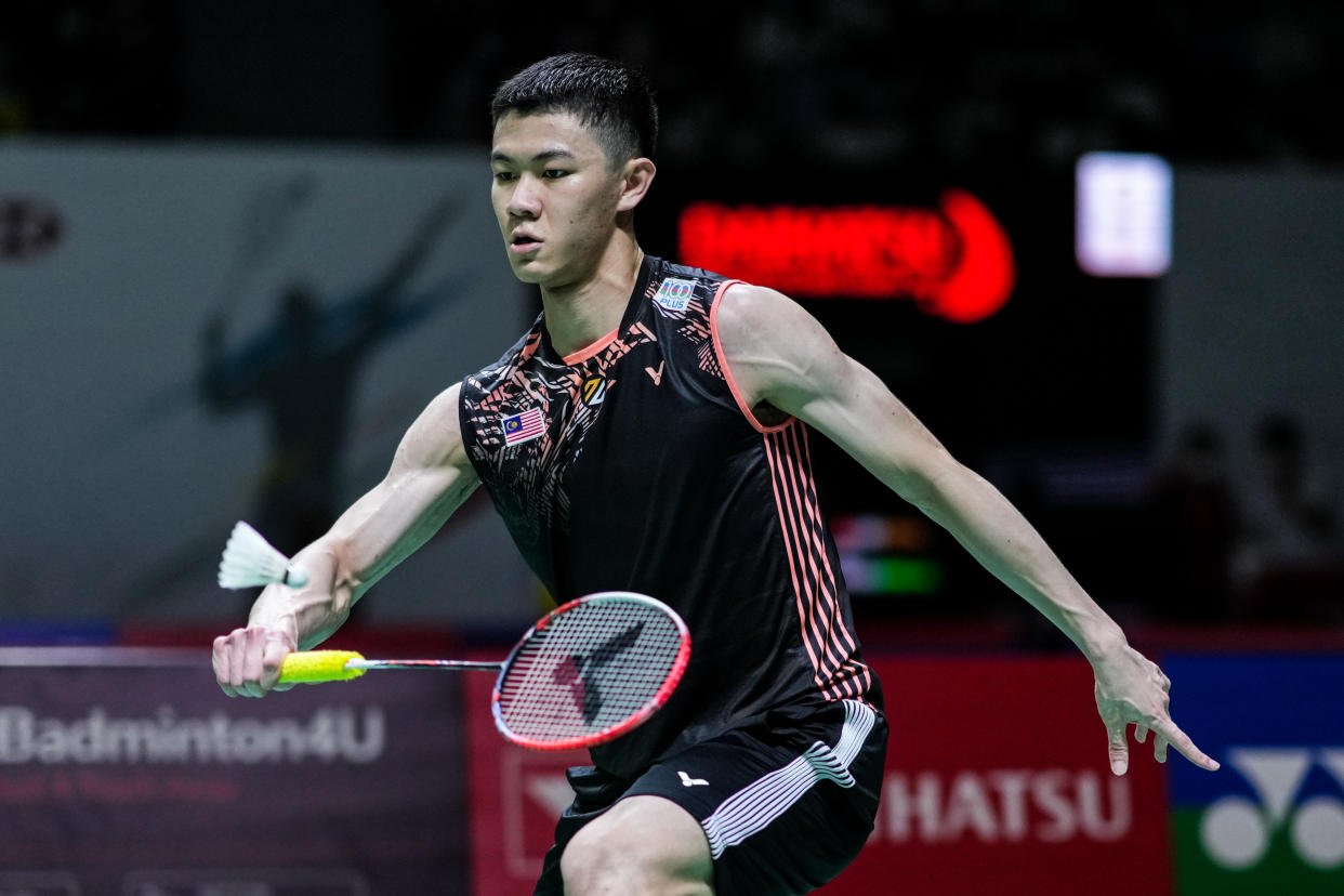 Malaysia shuttler Lee Zii Jia returns a shot at the Indonesia Masters tournament.