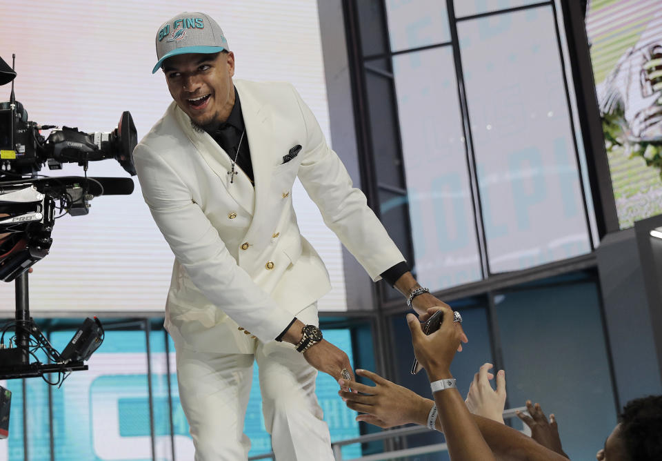 Alabama’s Minkah Fitzpatrick walks on stage after being selected by the Miami Dolphins during the first round of the NFL draft. (AP)