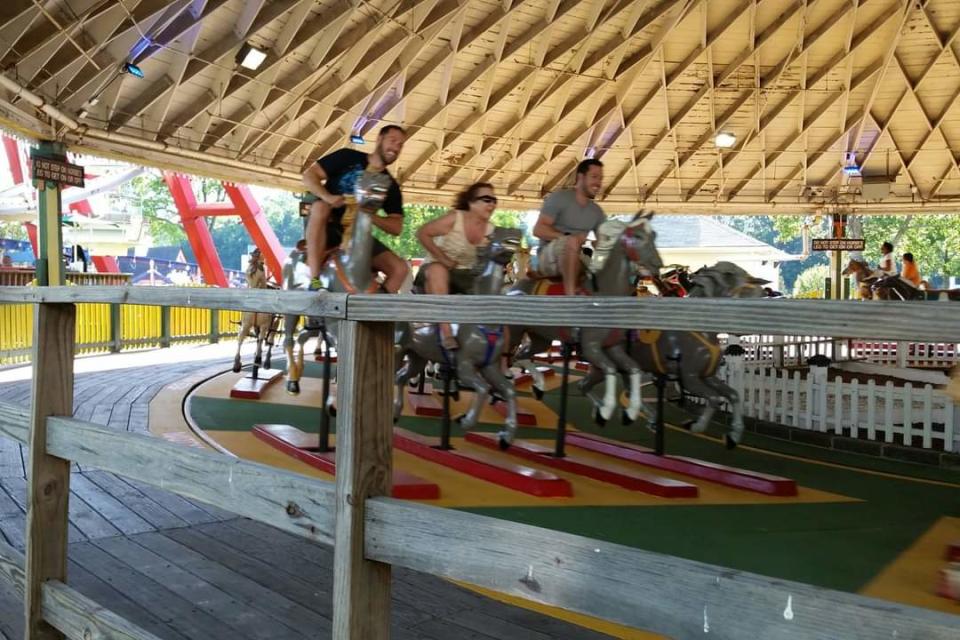 Derek, Doug and their mom Marie Perry took a spin on Derby Racer at Playland Park.