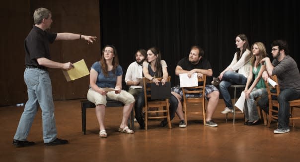 Actors rehearsing on stage