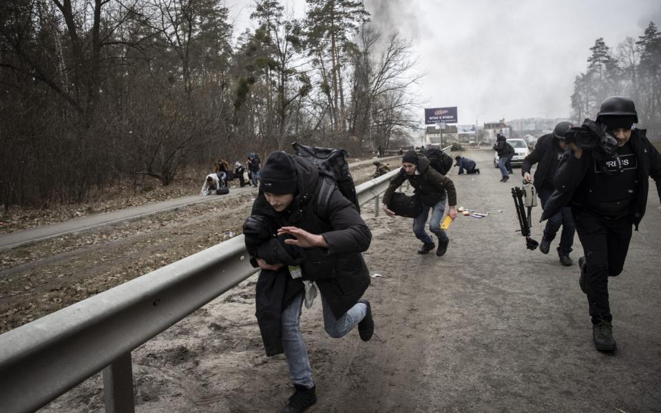 Views from vicinity of the bridge in the city of Irpin, northwest of Kyiv, blasts a few meters away during civilians' evacuation while ongoing Russian attacks on Ukraine, in Irpin, - Anadolu /Anadolu Agency