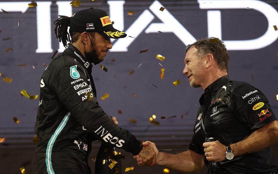 Lewis Hamilton shakes the hand of Christian Horner at the 2021 Abu Dhabi Grand Prix - Lewis Hamilton denies Red Bull approach and accuses Christian Horner of ‘stirring’