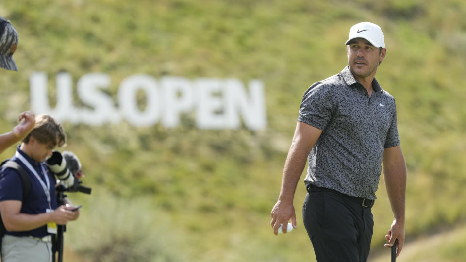 Brooks Koepka stands on the third green during a practice round of the U.S. Open golf tournament at Los Angeles Country Club, Monday, June 12, 2023, in Los Angeles. (AP Photo/Marcio Jose Sanchez)