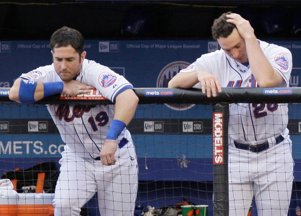 New York Mets' Ryan Church (left) and teammate Daniel Murphy stand in the dugout in the eighth inning of their game against the Florida Marlins at Shea Stadium in New York on Sunday, Sept. 28, 2008. The Marlins won the game, 4-2, keeping the Mets out of the playoffs.