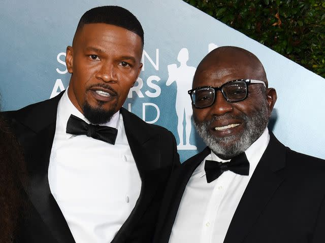 <p>Chris Polk/WireImage</p> Jamie Foxx and George Dixon attend the 26th Annual Screen Actors Guild Awards on January 19, 2020