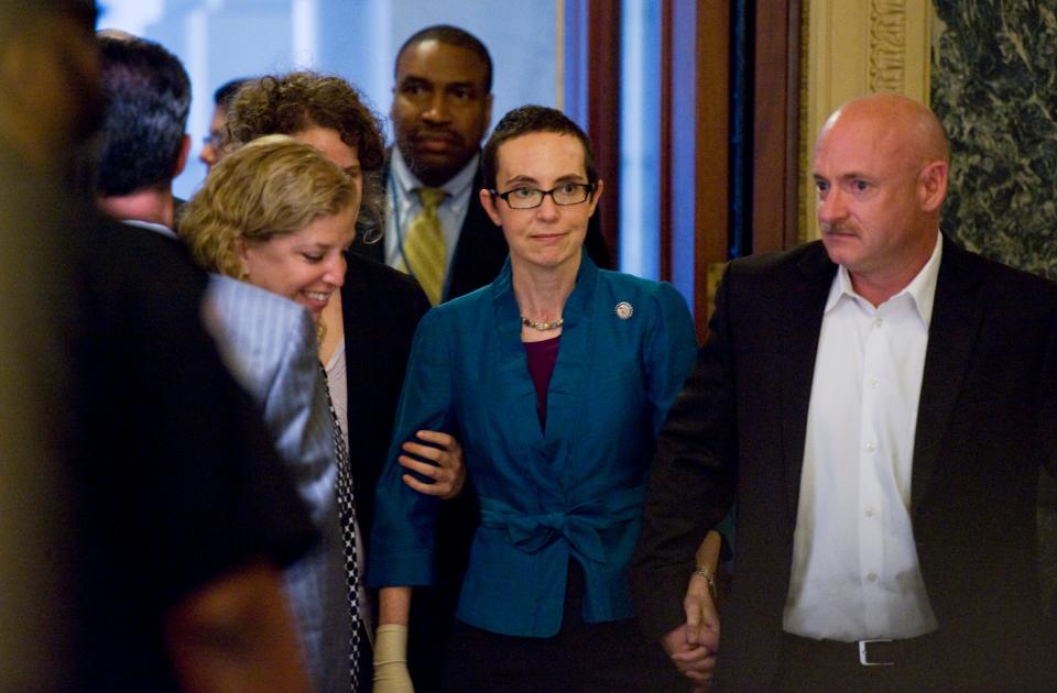 Gabrielle Giffords arrives at the Capitol with Mark Kelly and Rep. Debbie Wasserman Schultz.