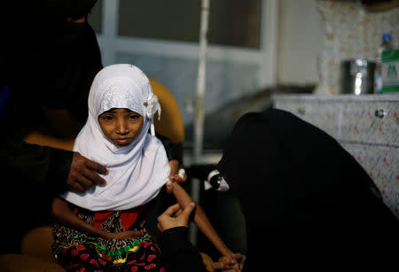 Afaf Hussein, 10, who is malnourished, receives an injection at a clinic in Sanaa, Yemen, February 14, 2019. A REUTERS/Khaled Abdullah