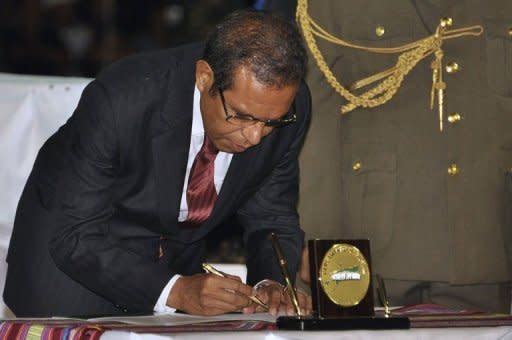 Taur Matan Ruak signs a register during the handover of power ceremony, in Dili. East Timor was set to celebrate a decade of independence from Indonesian rule Sunday, with new President Ruak leading festivities in a crucial year for the impoverished nation