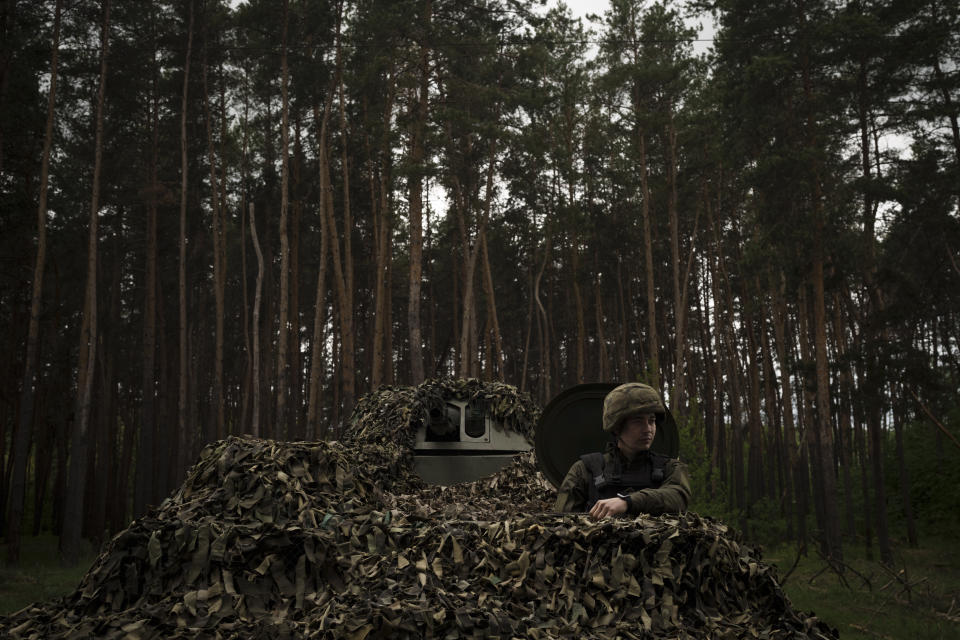 A Ukrainian National Guard soldier sits inside a tank at a position near Kharkiv, Ukraine, Monday, May 9, 2022. (AP Photo/Felipe Dana)