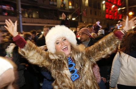 A reveller takes part in the Hogmanay (New Year) street party celebrations in Edinburgh, Scotland, January 1, 2014. REUTERS/Russell Cheyne