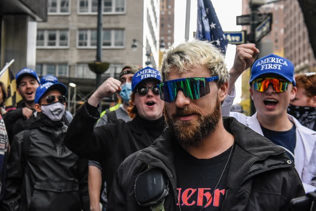 NEW YORK, NY - NOVEMBER 13: Far right livestreamer Baked Alaska (C) is cheered on by people associated with the far-right group America First in front of Pfizer world headquarters on November 13, 2021 in New York City. A U.S. Circuit Court granted an emergency stay to temporarily stop the Biden administration's vaccine requirement for businesses with 100 or more workers as many feel it is an unlawful overreach. (Photo by Stephanie Keith/Getty Images) (Photo: Stephanie Keith via Getty Images)