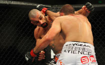 Constantinos Philippou of Cyprus and Court McGee of the USA exchange punches during the UFC On FX light middleweight bout at Allphones Arena on March 3, 2012 in Sydney, Australia. (Photo by Mark Kolbe/Getty Images)