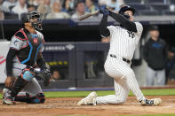 New York Yankees' Alex Verdugo follows through after hitting a solo home run in the second inning of a baseball game against the Miami Marlins, Tuesday, April 9, 2024, in New York. (AP Photo/Mary Altaffer)