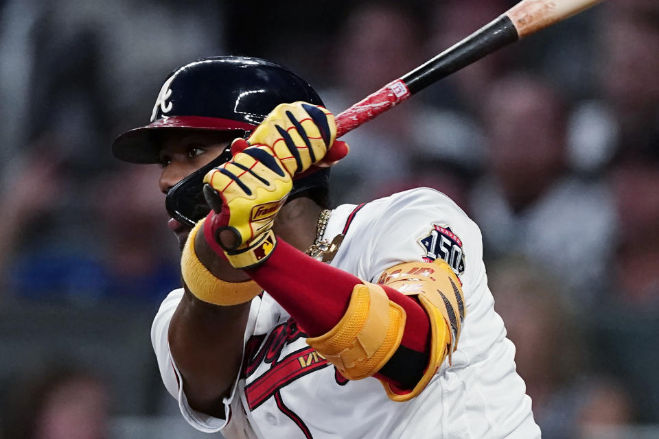Atlanta Braves' Ronald Acuna Jr. watches his two-run double during the fourth inning of the team's baseball game against the Boston Red Sox on Tuesday, June 15, 2021, in Atlanta. (AP Photo/John Bazemore)