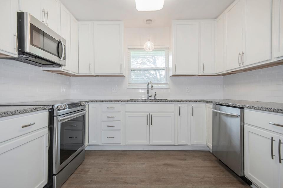 Ample counter space and stainless appliances are found in the kitchen.