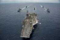 A joint US-Japan strike group headed by the Nimitz-class aircraft carrier USS Carl Vinson transits through the Philippine Sea on April 28, 2017