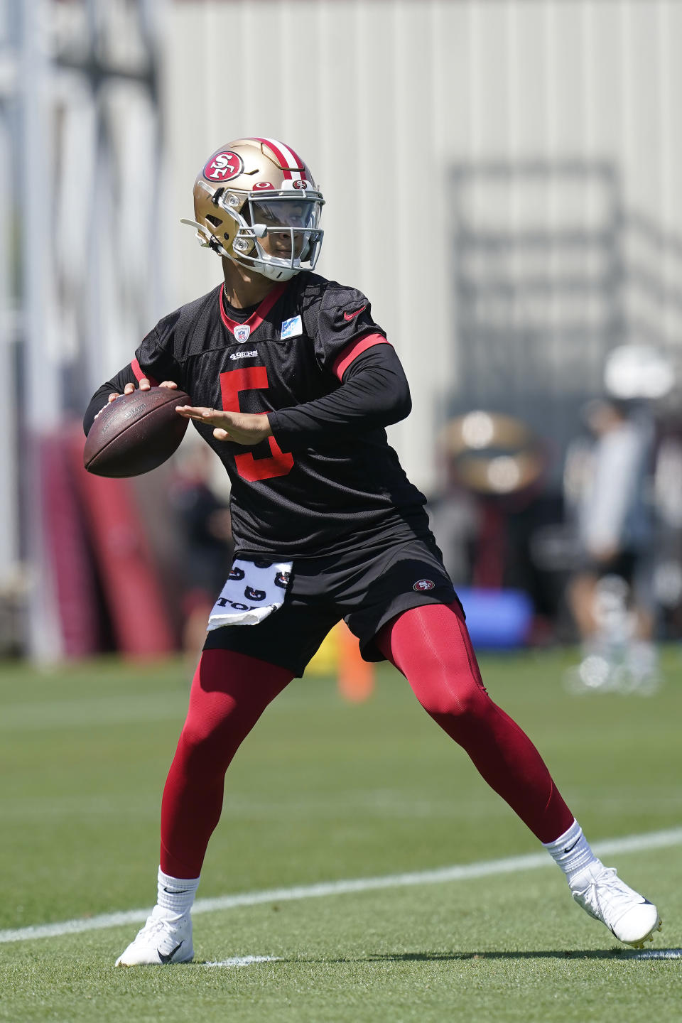 San Francisco 49ers quarterback Trey Lance (5) takes part in drills at the NFL football team's practice facility in Santa Clara, Calif., Tuesday, June 7, 2022. (AP Photo/Jeff Chiu)