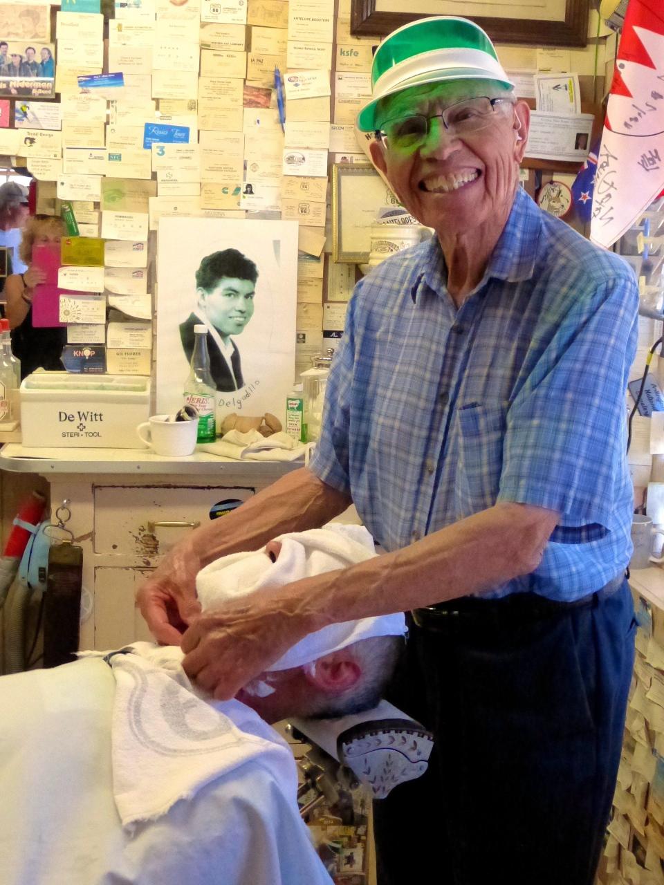 Angel Delgadillo, the "Guardian Angel of Route 66" in Seligman, first retired in 1997 but he could never refuse giving haircuts and shaves to Route 66 travelers.