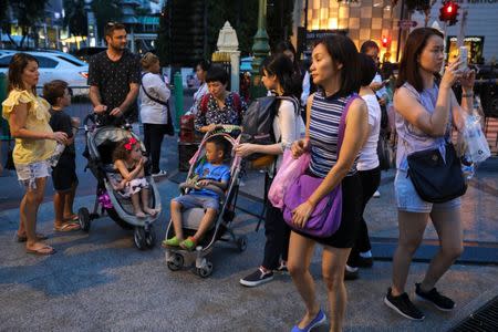 FILE PHOTO: Tourists are seen at Erawan Shrine, a Hindu shrine popular among tourists in central Bangkok, Thailand, October 16, 2017. REUTERS/Athit Perawongmetha/File Photo