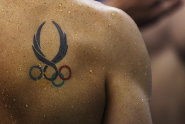 Olympic rings and some tattoos on an athlete's chest are seen during the  59th Settecolli swimming meeting at stadio del Nuoto in Rome (Italy), June  25 Stock Photo - Alamy