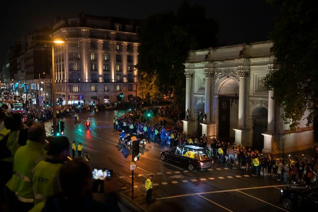 People gather near the Marble Arch. (Photo: Felipe Dana/AP)