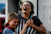 <p>Relatives of inmates held at the General Command of the Carabobo Police react as they wait outside the prison, where a fire occurred in the cells area, according to local media, in Valencia, Venezuela, March 28, 2018. (Photo: Carlos Garcia Rawlins/Reuters) </p>