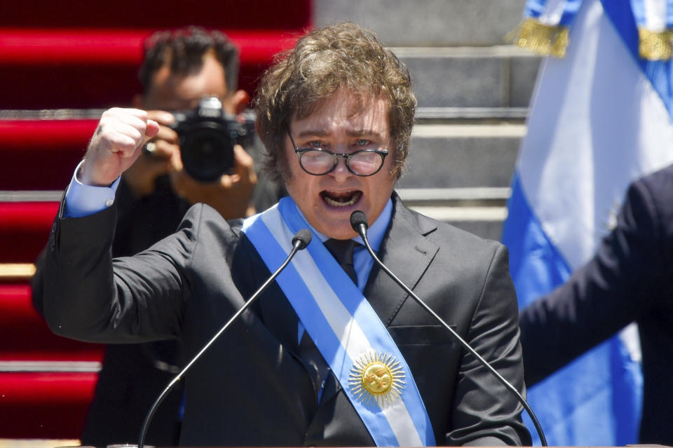 FILE- Argentina's newly sworn-in President Javier Milei speaks outside the Congress in Buenos Aires, Argentina, Dec. 10, 2023. Milei has drastically cut spending to end the fiscal deficit and contain inflation of almost 161% annually, including devaluing the peso more than 50%, dismissing public employees, suspending public works and reducing transportation and energy subsidies. (AP Photo/Gustavo Garello, File)