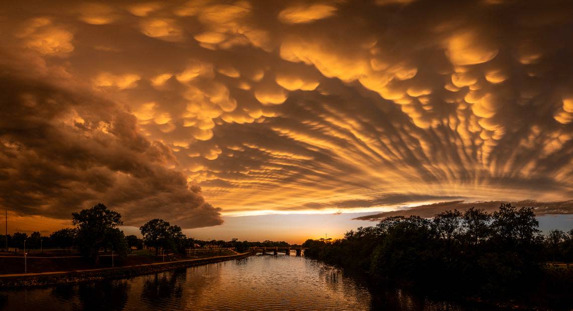 Mammatus clouds form over the Arkansas River after a line of thunderstorms passed through he Wichita area. Travis Heying/The Wichita Eagle