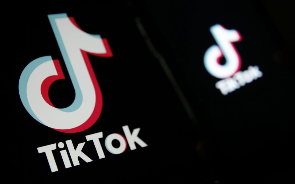 The TikTok logo is displayed on a laptop and smartphone in this arranged photograph in London, U.K., on Monday - Hollie Adams/Bloomberg