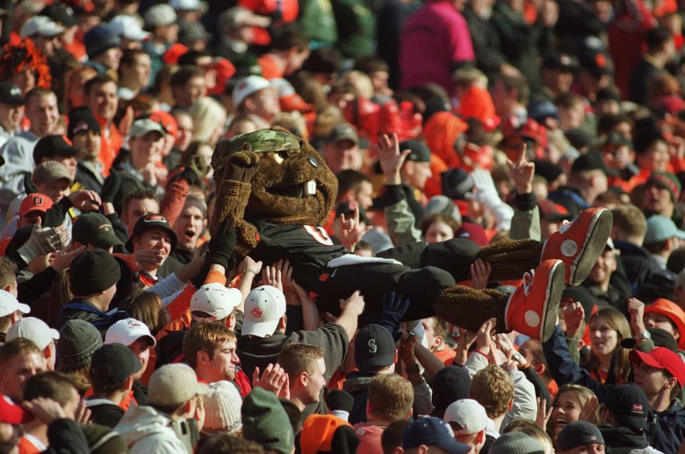 2000 — Oregon State fans give Benny Beaver a ride through the student section at Reser Stadium as the Beavers pull off the upset victory 23-13.