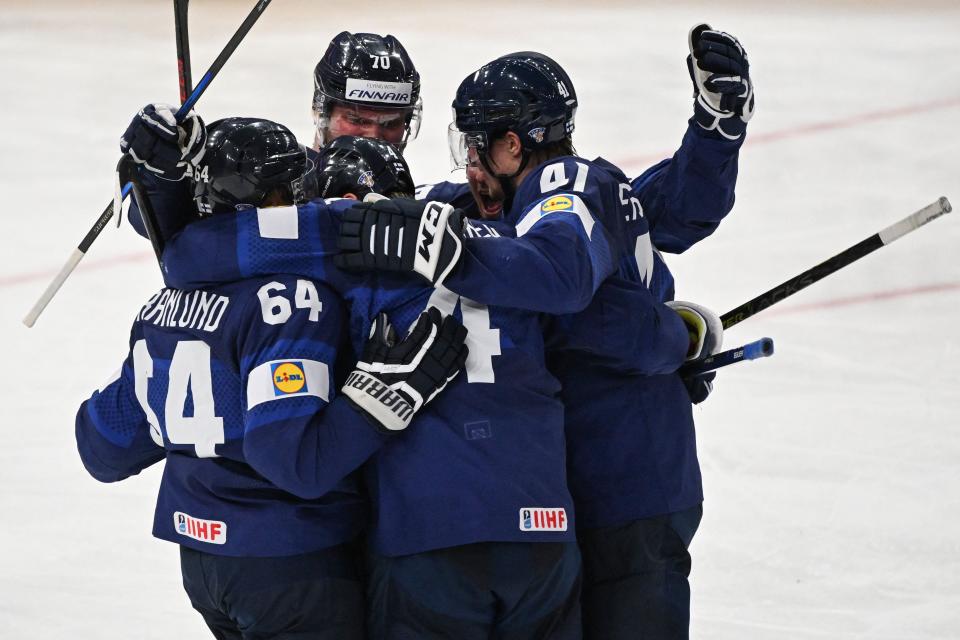 Finland forward Mikael Granlund, left, celebrates scoring during the World Championship final in Tampere, Finland, on May 29, 2022. Finland beat Canada, 4-3, in overtime.