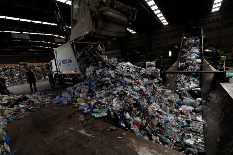 A truck dumps plastic for processing at Amarsul plant in Seixal