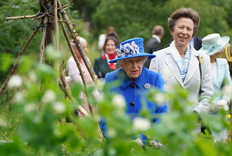 Queen Elizabeth II and Princess Anne visit The Children's Wood Project in Glasgow on June 30, 2021.