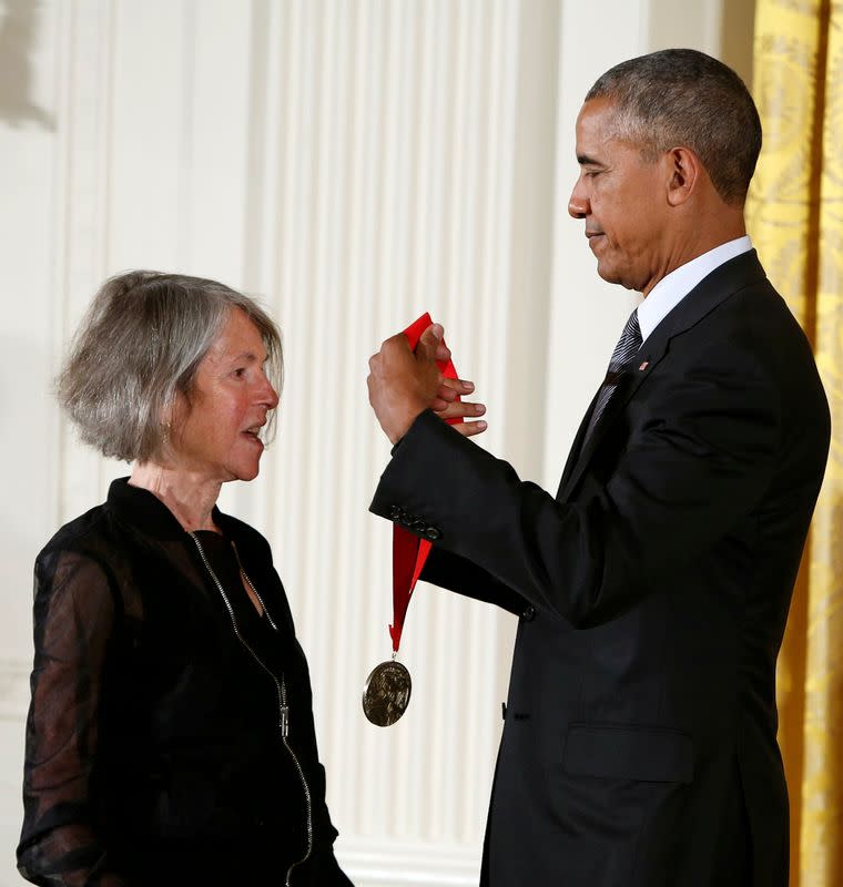 FILE PHOTO: U.S. President Barack Obama awards the 2015 National Humanities Medal to poet Gluck at the White House in Washington