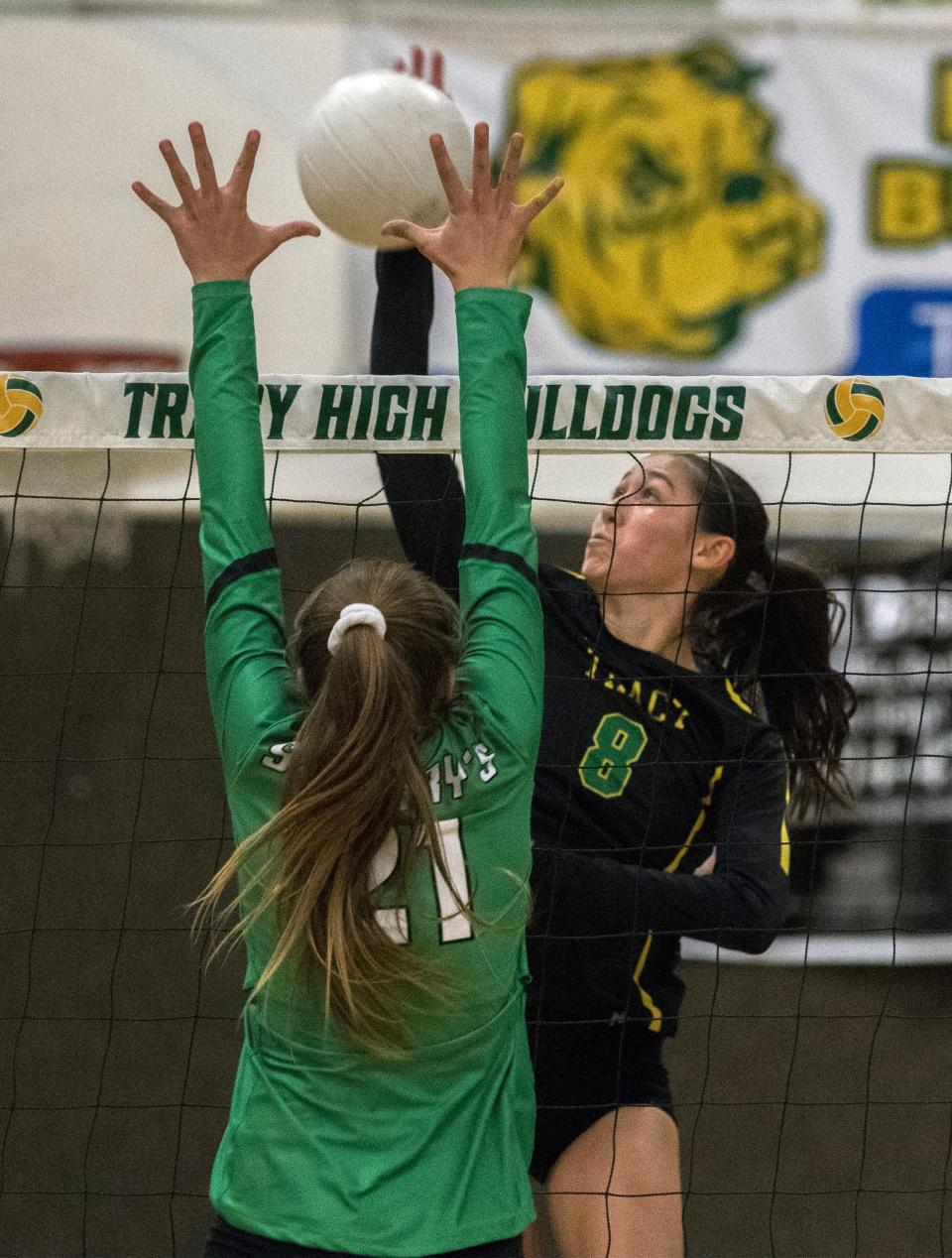 Tracy's Chloe Lemons spikes the ball on St. Mary's Cambria Waites during a girl's varsity volleyball match at Tracy.