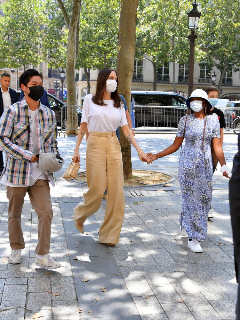 Angelina Jolie with children Pax, Zahara and Shiloh seen leaving Guerlain store on Champs Elysées Paris, July 22. - Credit: KCS Presse/MEGA