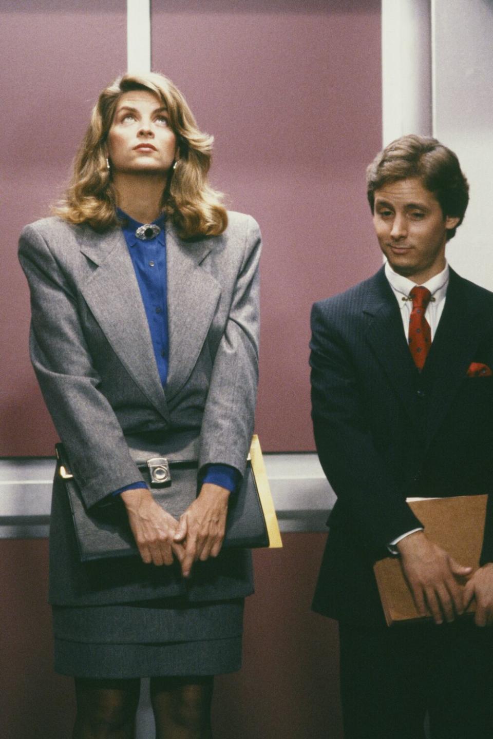 Kirstie Alley and Alex Nevil in an elevator on "Cheers"