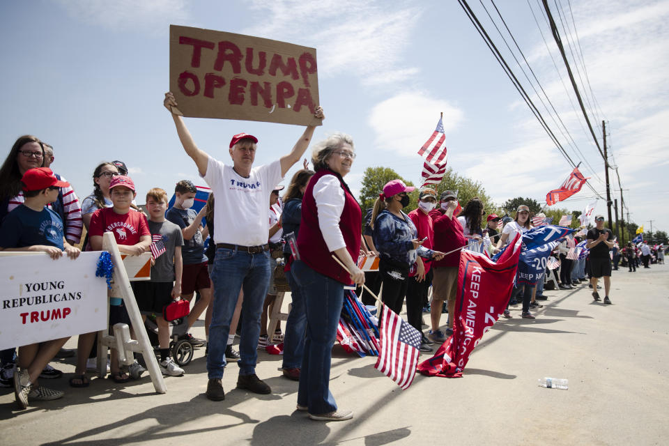Supporters line the side of the road waiting for the motorcade of President Donald Trump to drive past on Thursday, May 14, 2020, in Allentown, Pa. (AP Photo/Matt Rourke)