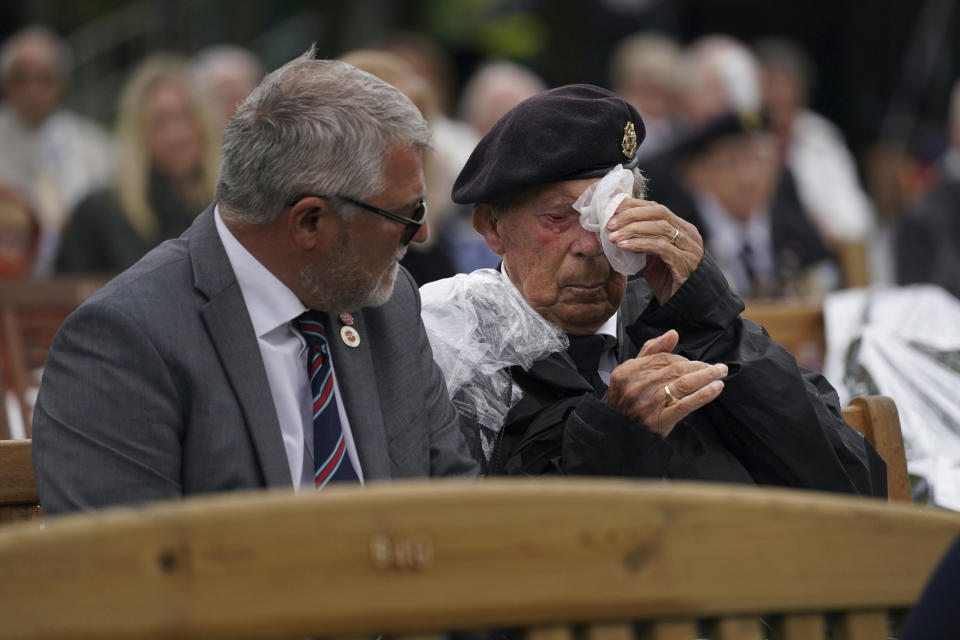 A veteran reacts, while watching the official opening of the British Normandy Memorial in France via a live feed, during a ceremony at the National Memorial Arboretum in Alrewas, England, Sunday, June 6, 2021. Several ceremonies are scheduled on Sunday to commemorate the 77th anniversary of D-Day that led to the liberation of France and Europe from the German occupation. On June 6, 1944, more than 150,000 Allied troops landed on code-named beaches, carried by 7,000 boats. (Jacob King/PA via AP)