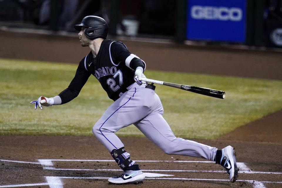 Colorado Rockies' Trevor Story watches his RBI single against the Arizona Diamondbacks during the first inning of the second game of a baseball doubleheader Friday, Sept. 25, 2020, in Phoenix. (AP Photo/Ross D. Franklin)