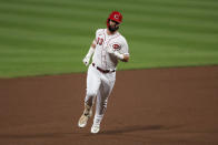 Cincinnati Reds' Jesse Winker runs the bases after hitting a solo home run during the fourth inning of the team's baseball game against the Milwaukee Brewers in Cincinnati, Wednesday, Sept. 23, 2020. (AP Photo/Aaron Doster)