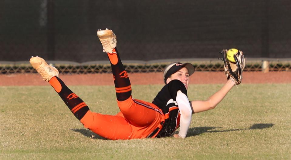 Spruce Creek High's Neena Hernandez (1) makes a diving catch, Thursday April 18, 2024 during the Five Star Conference softball championship game at the Ormond Beach Sports Complex.