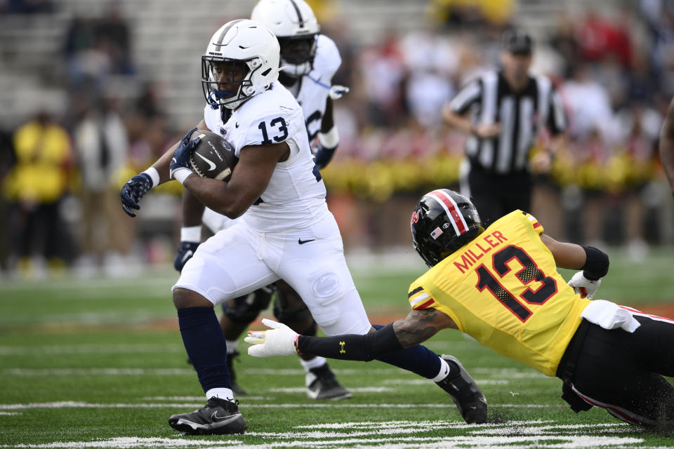 Penn State running back Kaytron Allen, left, runs the ball past Maryland defensive back Glendon Miller, right, during the first half of an NCAA college football game, Saturday, Nov. 4, 2023, in College Park, Md. (AP Photo/Nick Wass)