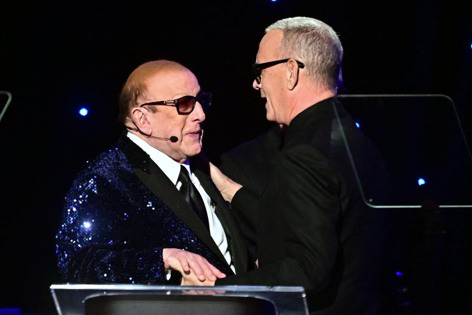 Tom Hanks (right) introduces Clive Davis at the record mogul's annual Salute To Industry Icons Pre-Grammy Gala at the Beverly Hilton in Beverly Hills, California on Feb. 3, 2024.
