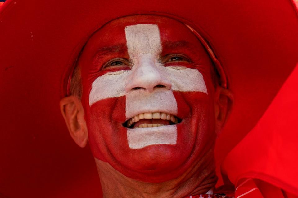 Switzerland's football team supporter cheers ahead of the World Cup group G football match between Switzerland and Cameroon, at the Al Janoub Stadium in Al Wakrah, Qatar, Thursday, Nov. 24, 2022. (AP Photo/Ricardo Mazalan)