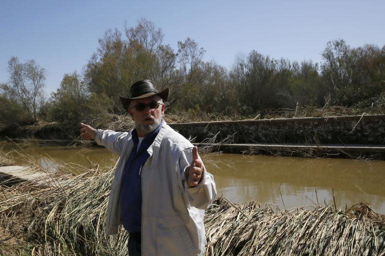 Israeli official Boaz Kretschmer -- the head of strategy at Eshkol Regional Council -- points to what remains of the flood water in Nahal Besor, a seasonal stream in the Western Negev, on February 26, 2015